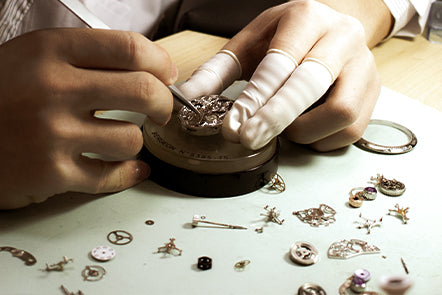 Movement assembly at the watchmaker’s bench.